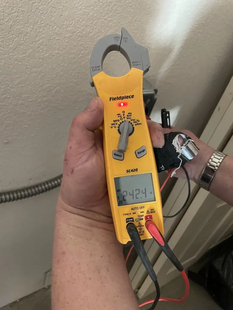 Voltage testing with clamp meter during Ceiling Fan Installation in Lake Barcroft